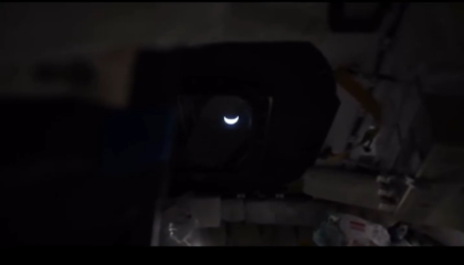 crescent Earth viewed from capsule window, lights off