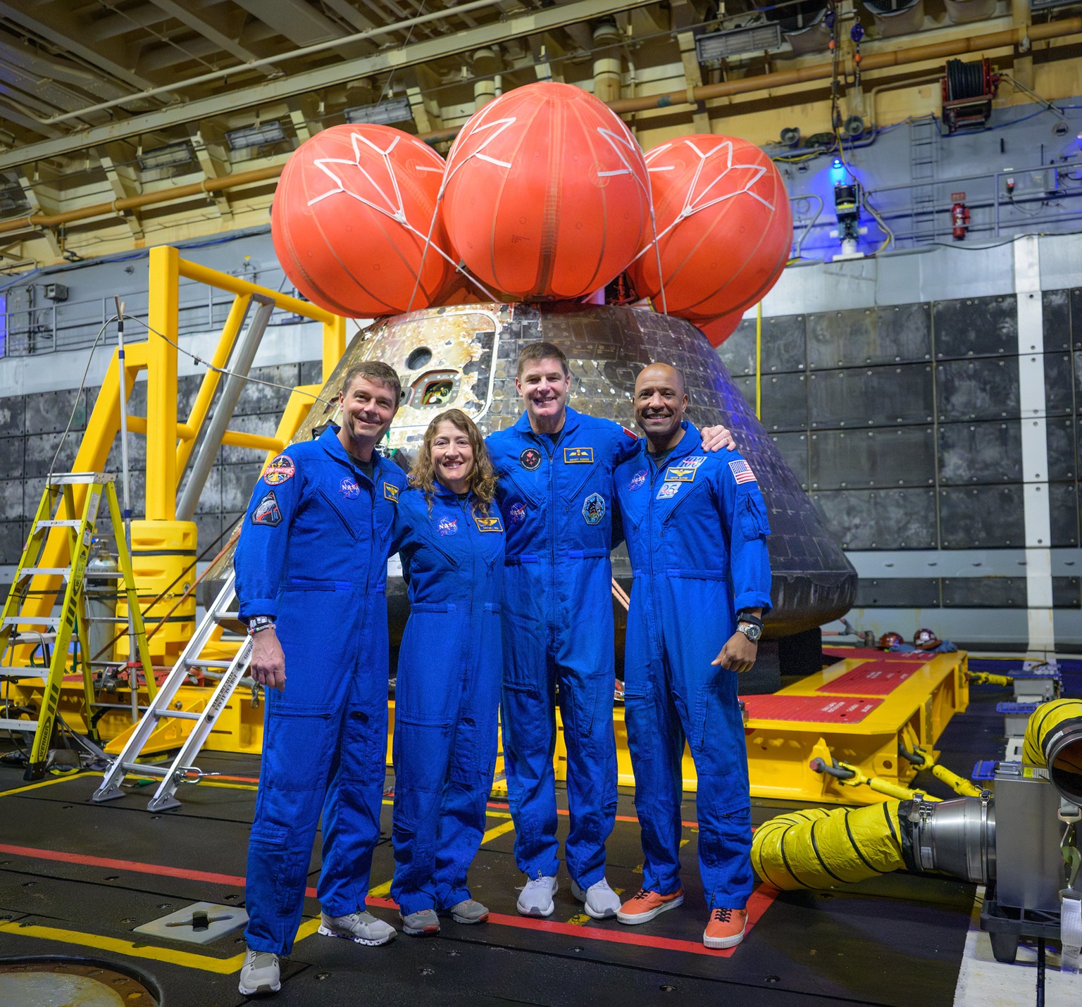 Artemis2 crew with Integrity capsule, well deck of USS John P. Murtha