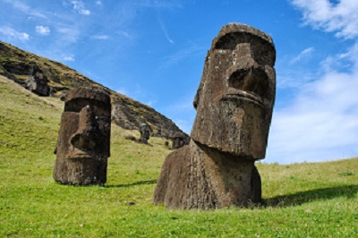 Easter Island heads on green hillside