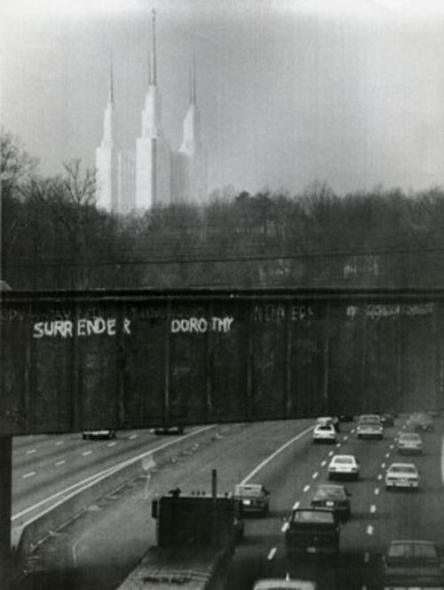 Mormon Temple viewed from I-495 Beltway. Grafitti on bridge reads, 'Surrender Dorothy'