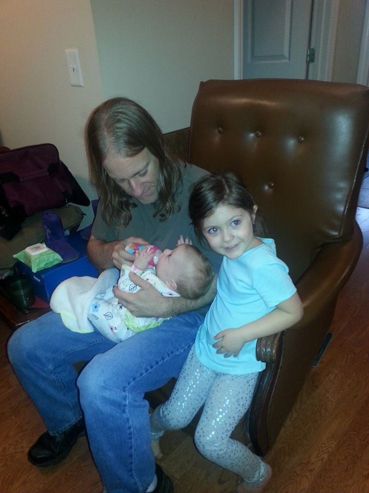 Me bottle feeding tiny Aeryn with Reagan helping