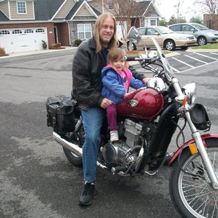 Little Reagan and me on my motorcycle