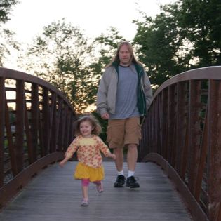 Reagan running on arched wooden bridge